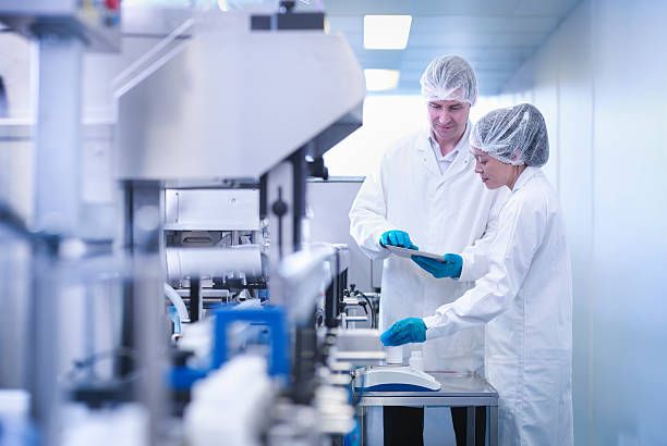 17,973 factory workers stock photos, high res pictures, and images getty images